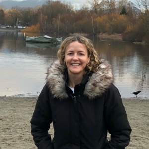 headshot of Catherine by the water